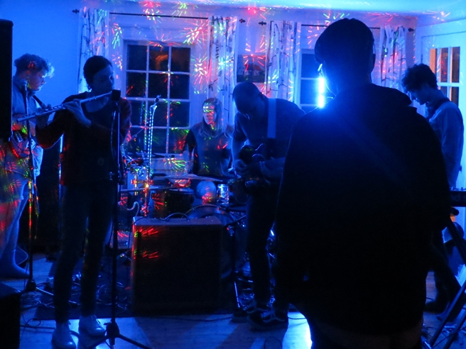 The band Moon playing in a living room in Mineville, Nova Scotia in 2013